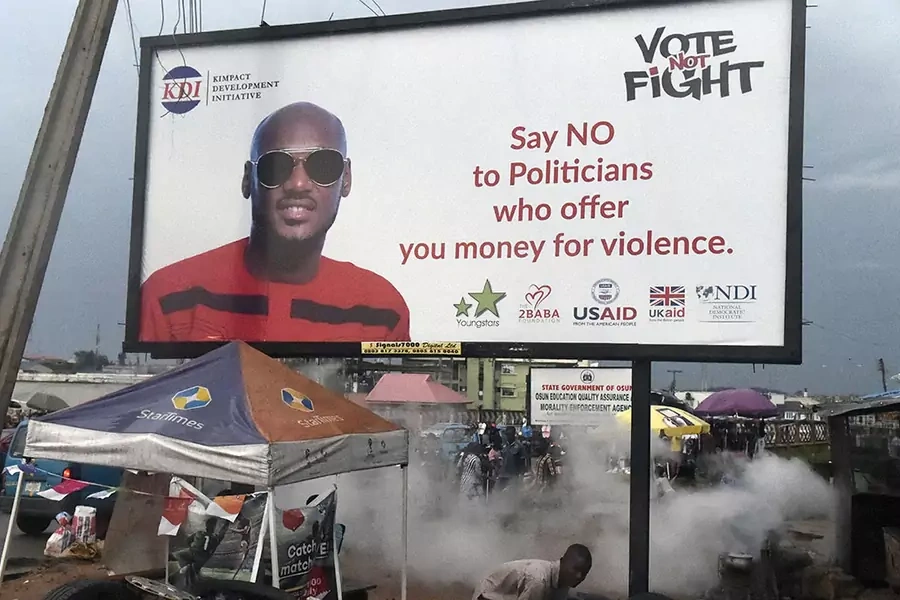 A billboard displays the songwriter Innocent Ujah Idibia popularly known as '2Face' as part of a campaign against politicians who allegedly offer money to youths to foment trouble during elections, in Oshogbo, Osun State, Nigeria on September 21, 2018.