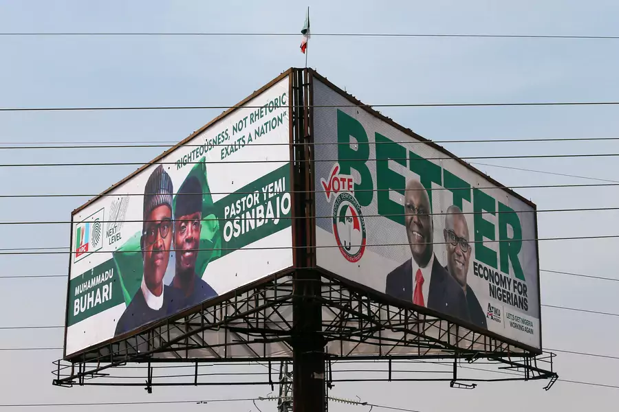 Campaign billboards with Nigeria's President Muhammadu Buhari with Vice President Yemi Osinbajo, and Nigeria's main opposition party presidential candidate Atiku Abubakar with his running mate, Peter Obi, in Abuja, Nigeria, on February 5, 2019.