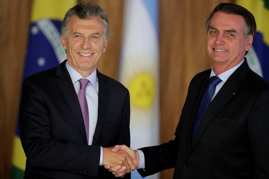 Argentina's President Mauricio Macri shakes hands with Brazil's President Jair Bolsonaro during a meeting in Brasilia, Brazil January 16, 2019. 