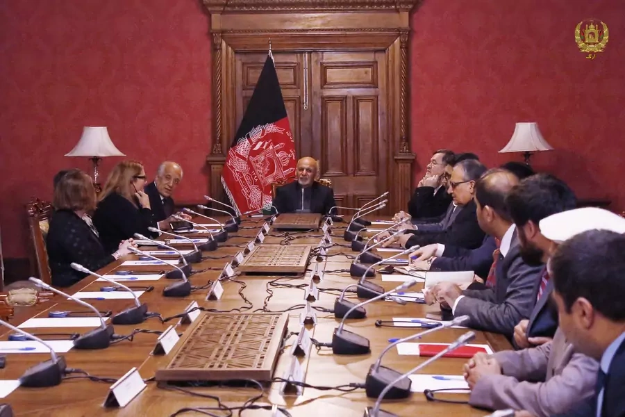 Afghanistan's President Ashraf Ghani talks with the U.S. Special Envoy Zalmay Khalilzad during a meeting in Kabul, Afghanistan, on January 27, 2019.