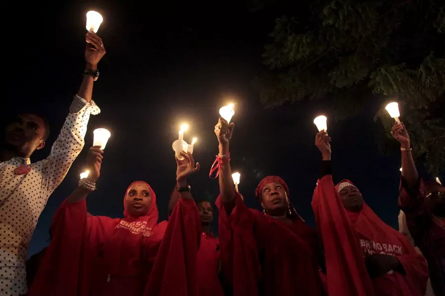 #BringBackOurGirls campaigners raise candles during a candle light gathering marking the 500th day since the abduction of girls in Chibok, Nigeria. August 27, 2015. 