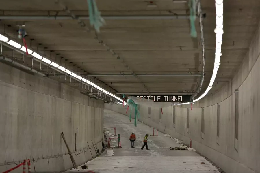 Workers are pictured on the northbound lanes, at the lower level, of the double deck State Route 99 (SR 99) highway tunnel, under construction in Seattle Washington, U.S., March 27, 2018.
