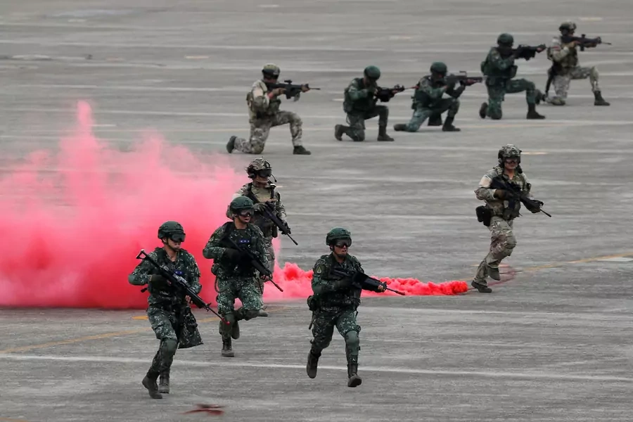 Soldiers take part in a military drill simulating an invasion of Taiwan by China's People's Liberation Army at Ching Chuan Kang Air Base in Taichung, Taiwan, on June 7, 2018.