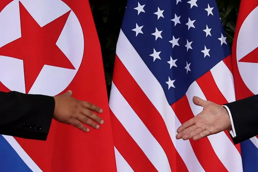 U.S. President Donald Trump and North Korean leader Kim Jong-un meet at the start of their summit at the Capella Hotel on the resort island of Sentosa, Singapore on June 12, 2018.