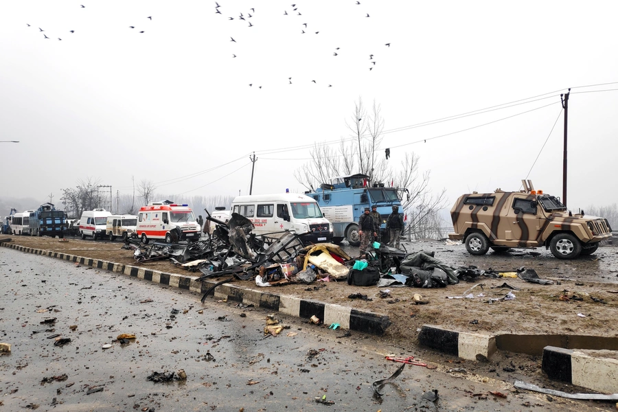 Indian soldiers examine the debris after an explosion in Lethpora in south Kashmir's Pulwama district February 14, 2019.