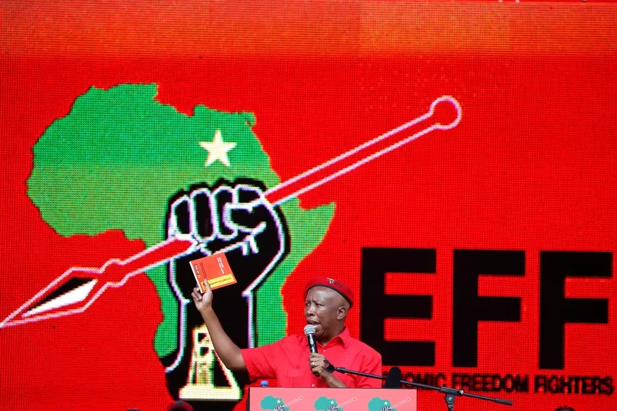 President of South Africa's radical left-wing party, the Economic Freedom Fighters (EFF), Julius Malema, holds a copy of the party's election manifesto in Soshanguve, near Pretoria, South Africa, on February 2, 2019. 