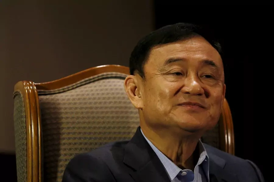 Former Thai Prime Minister Thaksin Shinawatra looks on as he speaks to Reuters during an interview in Singapore on February 23, 2016.
