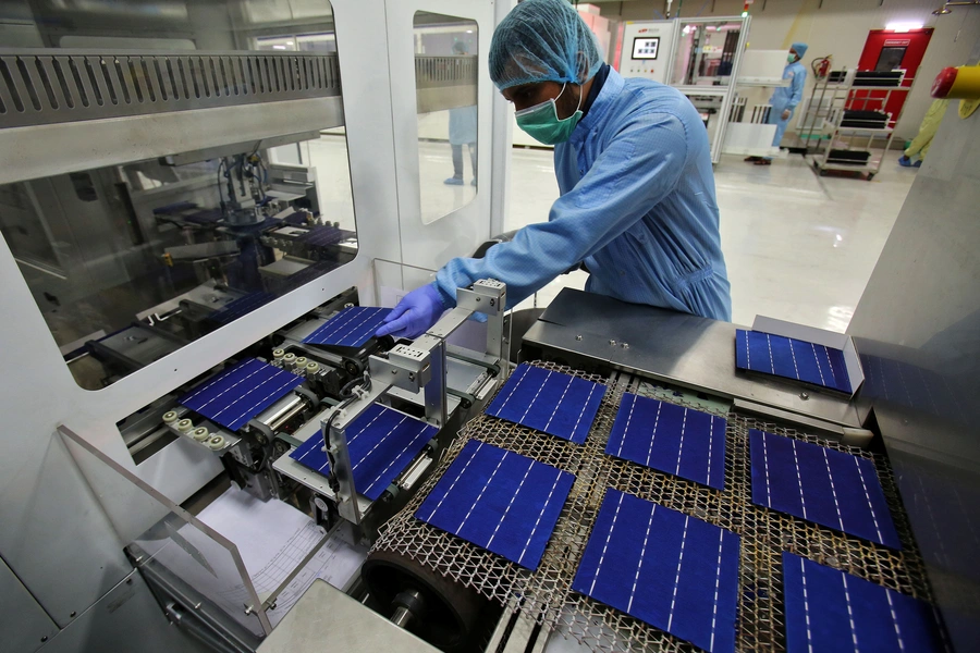 An employee works at a solar cell production line at Jupiter Solar Power Limited (JSPL) plant in Baddi, in the northern state of Himachal Pradesh, India May 29, 2017.