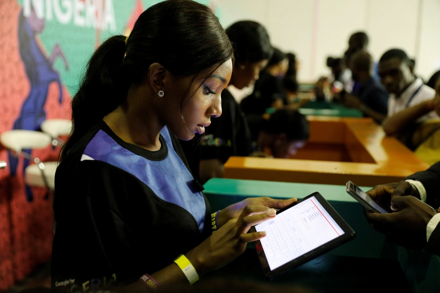 Youths are seen browsing the internet at the launch of Google's free WiFi project in Lagos, Nigeria on July 26, 2018.