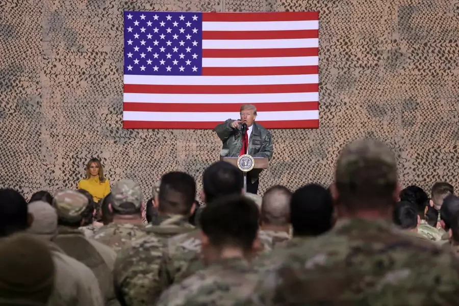 U.S. President Donald Trump, with first lady Melania Trump, delivers remarks to U.S. troops in an unannounced visit to Al Asad Air Base, Iraq, December 26, 2018.