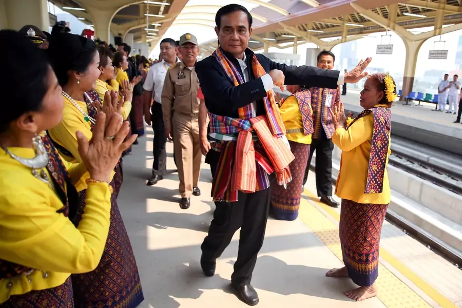 Thailand's Prime Minister Prayuth Chan-ocha performs a traditional dance with performers at Khon Kaen railway station during a visit ahead of the general election in Khon Kaen Province, Thailand, on March 13, 2019. 