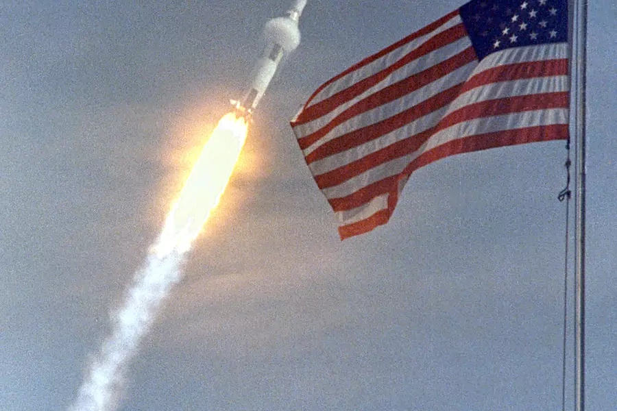 The American flag heralds the launch of Apollo 11, the first lunar landing mission, on July 16, 1969.