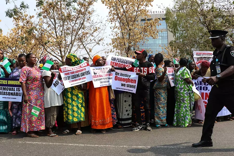 Protesters holding signs assemble outside the secretariat of the Nigerian Bar Association during a protest in Abuja over the suspension of Chief Justice of Nigeria (CJN) in Abuja on January 28, 2019.