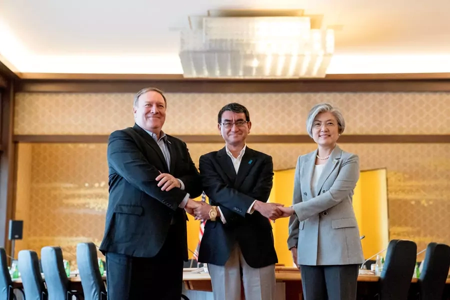 U.S. Secretary of State Mike Pompeo, Japan's Foreign Minister Taro Kono, and South Korea's Foreign Minister Kang Kyung-wha shake hands as they meet in Tokyo, Japan on July 8, 2018.