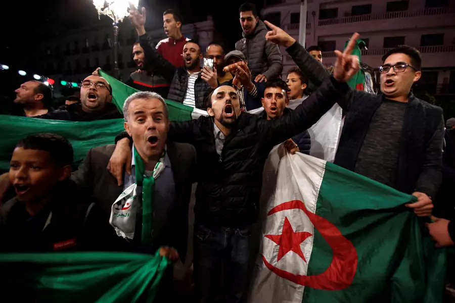 People celebrate on the streets after Algeria's President Abdelaziz Bouteflika has submitted his resignation, in Algiers, Algeria April 2, 2019.