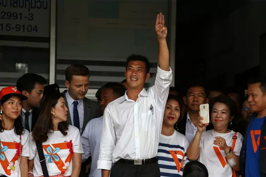 Thanathorn Juangroongruangkit, leader of the Future Forward Party, flashes a three-finger salute to his supporters as he leaves a police station after hearing a sedition complaint filed by the army in Bangkok, Thailand, on April 6, 2019.