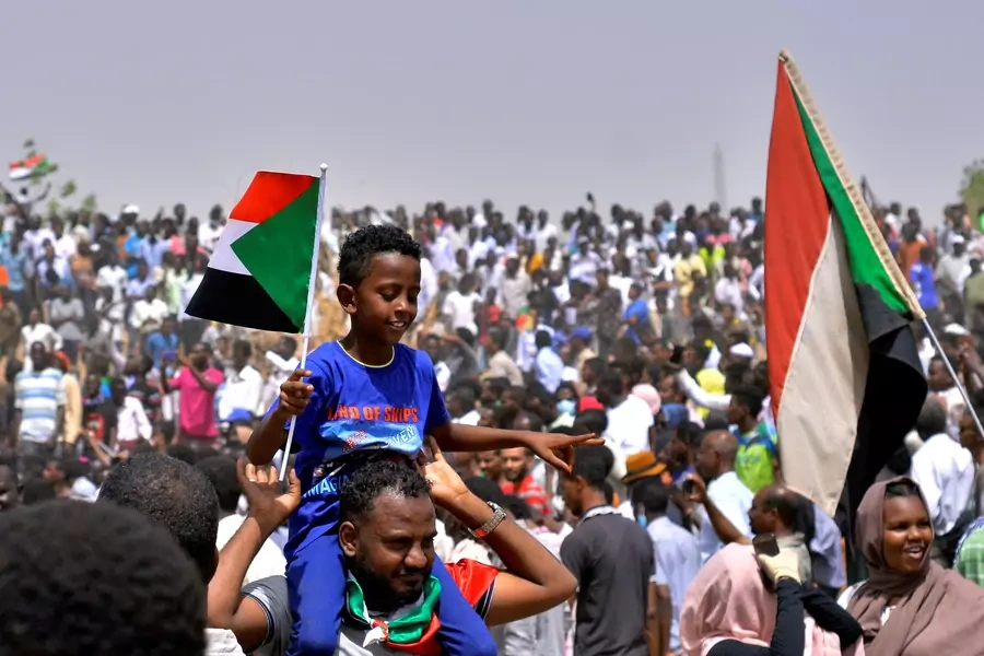  Sudanese demonstrators celebrate after the announcement that President Omar al-Bashir had been detained and a military council would run the country for a two-year transitional period, Khartoum, Sudan April 11, 2019.
