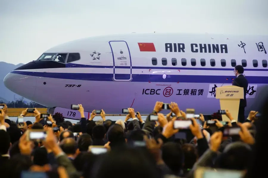 Guests attend a ceremony marking the 1st delivery of a Boeing 737 Max 8 passenger airplane to Air China at the Boeing Zhoushan completion center in Zhoushan, Zhejiang province, China, December 15, 2018. 