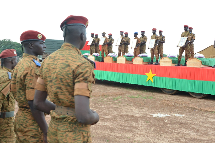 Soldiers take part in the funeral ceremony of the seven members of the security forces killed three days ago after their vehicle struck a roadside bomb in eastern Burkina Faso, on August 31, 2018, in Ouagadougou.