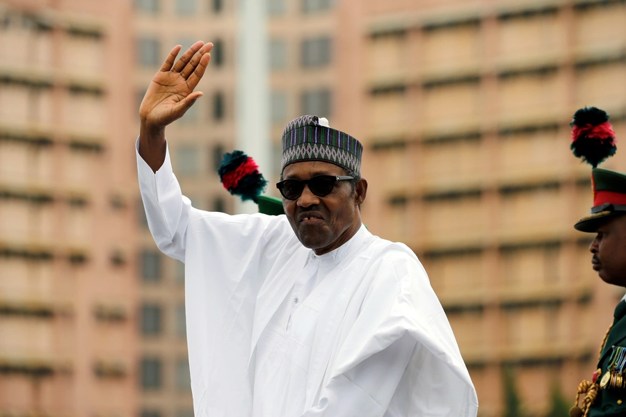 Nigerian President Muhammadu Buhari waves at the crowd while he drives around the venue during his inauguration for a second term in Abuja, Nigeria, on May 29, 2019.