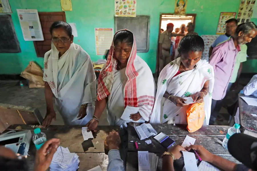 Women at a polling station during the first phase of general election in the northeastern Indian state of Assam, 2019. 