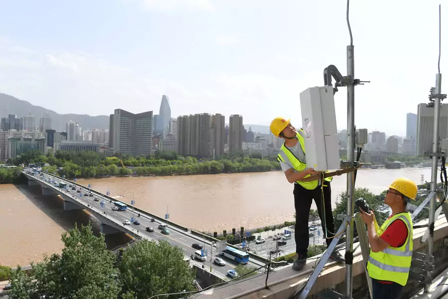 China Telecom technicians test an equipment at the 5G network base station near Yellow River in Lanzhou, Gansu province, China May 16, 2019. Picture taken May 16, 2019.