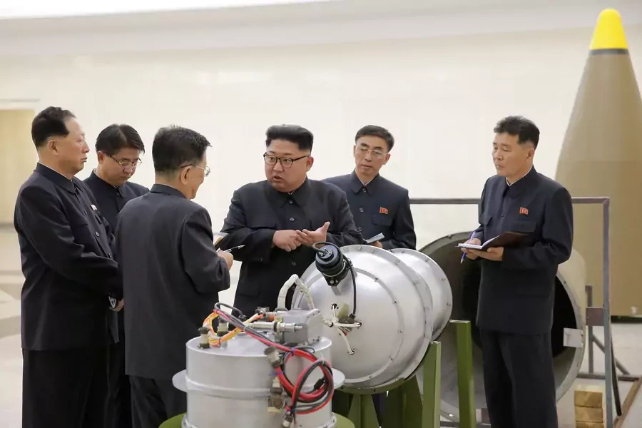 North Korean leader Kim Jong-un provides guidance with Ri Hong-sop (3rd L) and Hong Sung-mu (L) on a nuclear weapons program in this undated photo released by North Korea's Korean Central News Agency on September 3, 2017. 