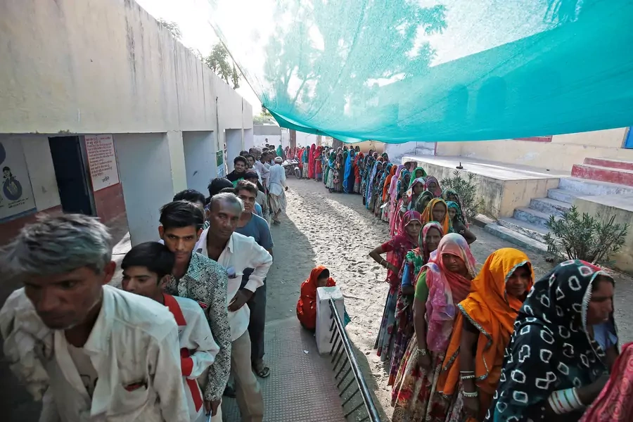 People wait to cast their vote at a Sirohi district polling station in the Indian state of Rajasthan, India on April 29, 2019. 
