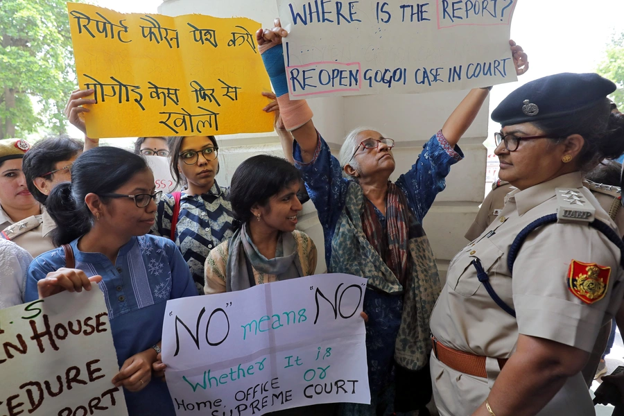 Demonstrator hold placards during a protest after a panel of judges dismissed a sexual harassment complaint against Chief Justice of India (CJI) Ranjan Gogoi in New Delhi, India, May 8, 2019.