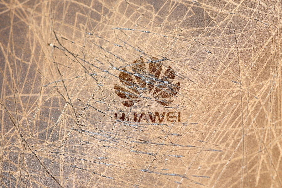 A scratched surface Huawei logo is seen on a smarthphone in this illustration picture 