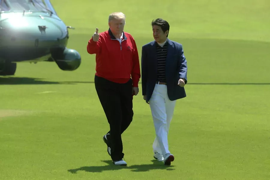 Japan's Prime Minister Shinzo Abe welcomes U.S. President Donald Trump upon his arrival at Mobara Country Club in Chiba prefecture, Japan, on May 26, 2019.