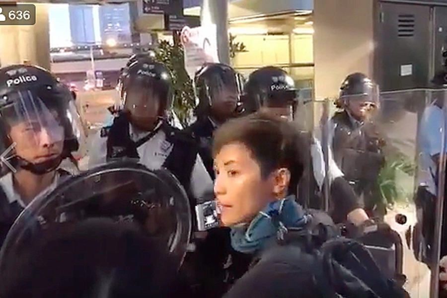 Hong Kong democracy activist Denise Ho live-streaming protest clashes with police on Facebook.