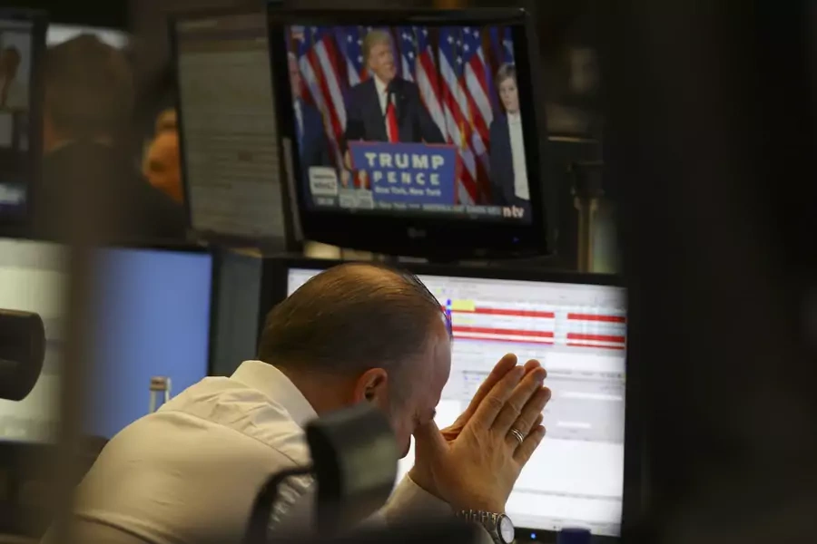 A trader at the stock exchange reacts in Frankfurt, Germany on November 9, 2016.