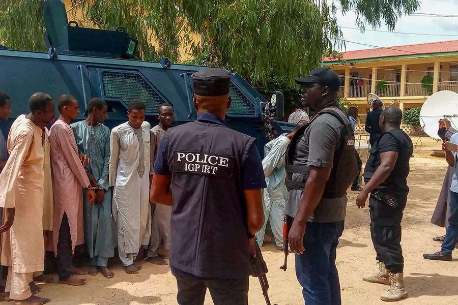 Police officers outline suspected Boko Haram militants in Maiduguri, northeast Nigeria, on July 18, 2018.
