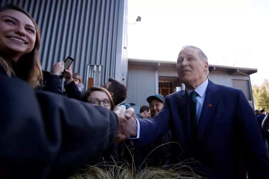 Jay Inslee meets with A&R Solar employees in Seattle after a news conference to announce his decision to seek the Democratic Party's nomination for president. Lindsey Wasson/REUTERS