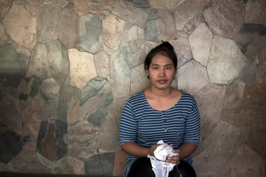 Suay Ing, daughter of migrant construction workers from Myanmar, was fourteen years old when she was trafficked to Bangkok, Thailand, by a broker who promised her a job and abandoned her. May 25, 2015.