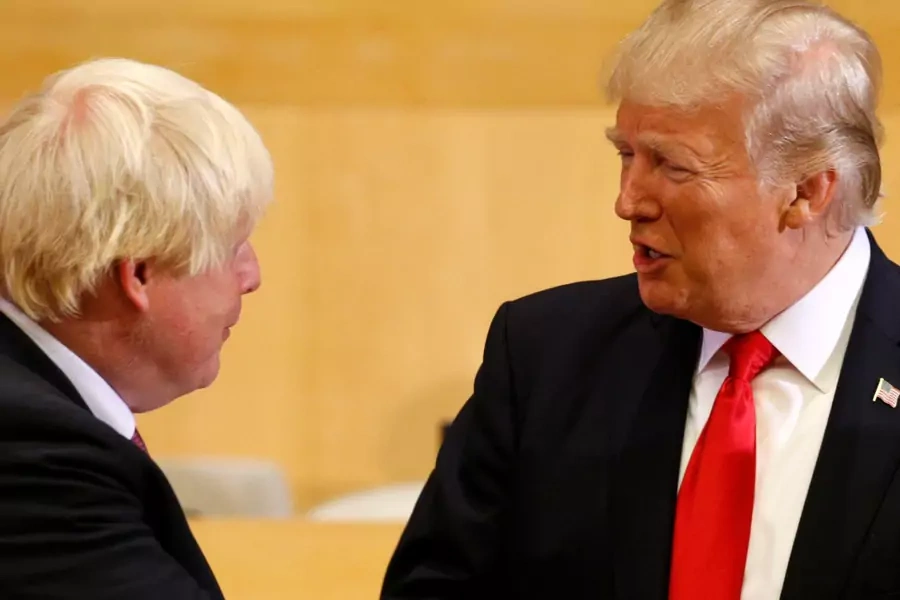 U.S. President Donald Trump greets British Foreign Secretary Boris Johnson (L) as they take part in a session on reforming the United Nations at U.N. Headquarters in New York, U.S., September 18, 2017.