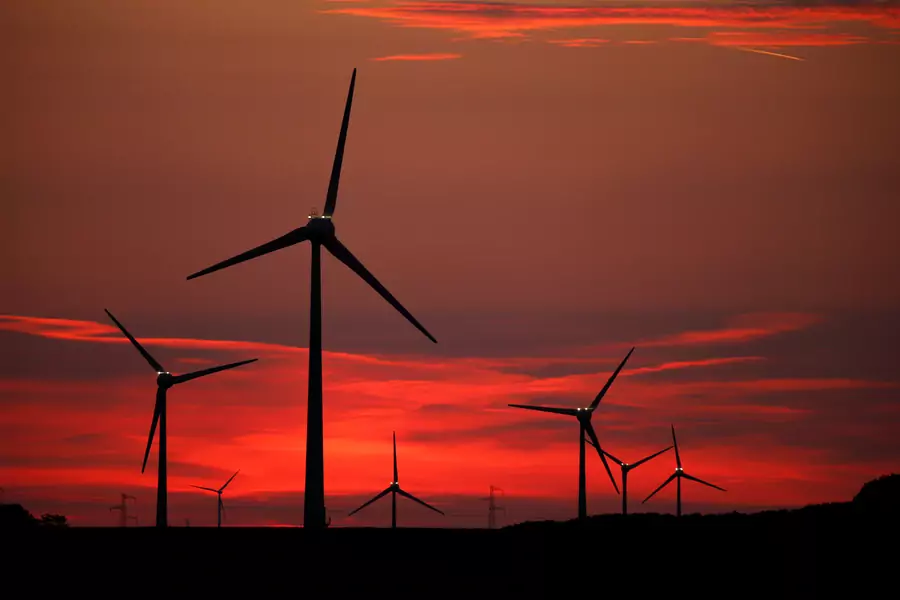 Power-generating windmill turbines are pictured at sunset at a wind park in Cagnicourt near Cambrai, France, May 22, 2019.