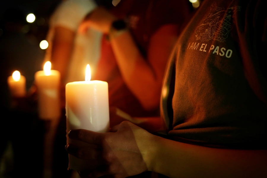 Mourners take part in a vigil at El Paso High School after a mass shooting at a Walmart store in El Paso, Texas, U.S. August 3, 2019.