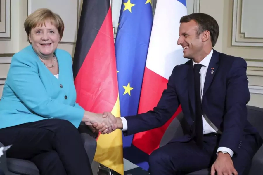 German Chancellor Angela Merkel shakes hands with French President Emmanuel Macron during a bilateral meeting in Biarritz, France, on August 24, 2019.