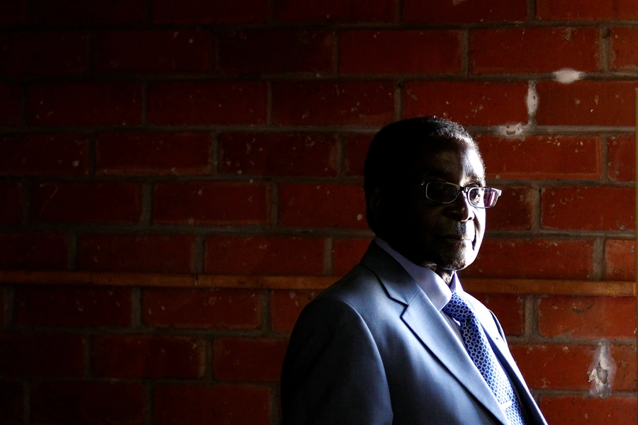 Zimbabwe's former President Robert Mugabe looks on before casting his vote in Highfields outside Harare on July 31, 2013