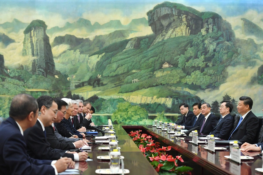 International Monetary Fund Managing Director Christine Lagarde speaks with Chinese President Xi Jinping (R) during their meeting at the Great Hall of the People in Beijing, China , April 24, 2019. 