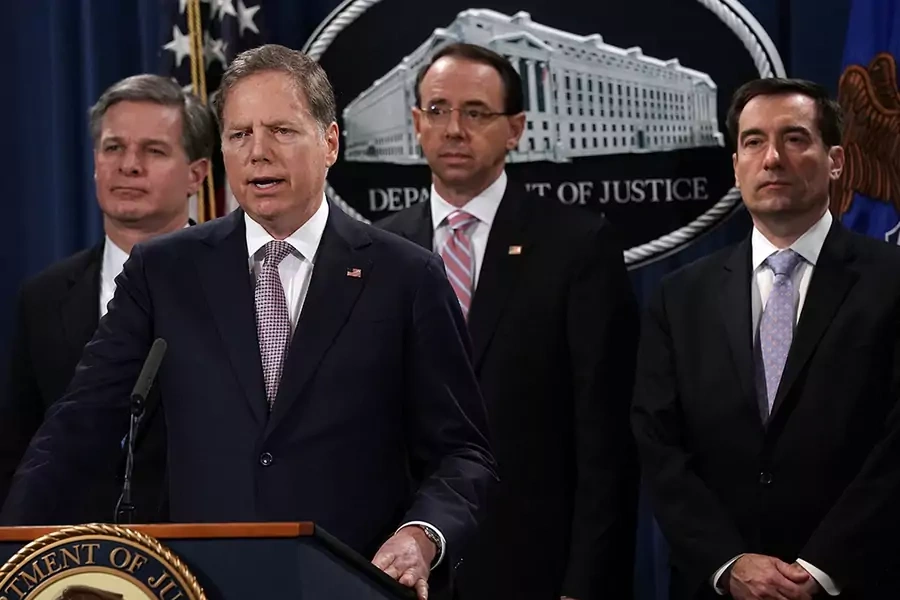 U.S. Attorney for the Southern District of New York Geoffrey Berman (2nd L) speaks as (L-R) FBI Director Christopher Wray, U.S. Deputy Attorney General Rod Rosenstein and Assistant Attorney General for National Security John Demers listen during a news co