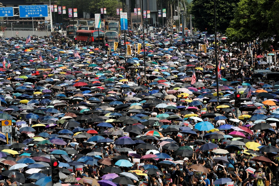 Anti-government protesters gather at the start of a protest march in Hong Kong's tourism district of Tsim Sha Tsui, China, on October 20, 2019.