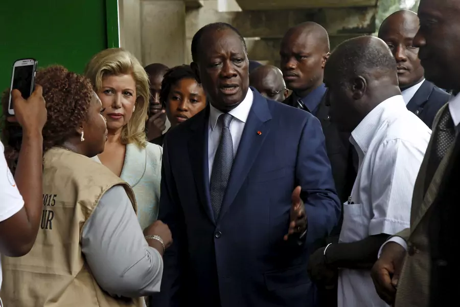 Côte d'Ivoire's President Alassane Ouattara of the Rally of the Houphouetists for Democracy and Peace (RHDP) party talks after casting his vote at a polling station during a presidential election in Abidjan, Côte d'Ivoire on October 25, 2015