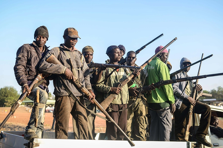  Local hunters armed with locally made guns in Yola city of Adamawa State in Nigeria before they move to border region between Nigeria and Cameroon to support Nigerian army fighting Boko Haram militants on December 06, 2014.