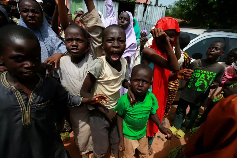 Children protest outside the building where hundreds of men and boys were rescued from captivity by police in Kaduna, Nigeria, on September 28, 2019. 