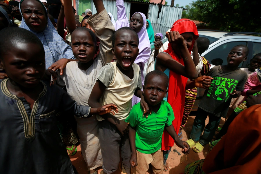 Children protest outside the building where hundreds of men and boys were rescued from captivity by police in Kaduna, Nigeria, on September 28, 2019. 