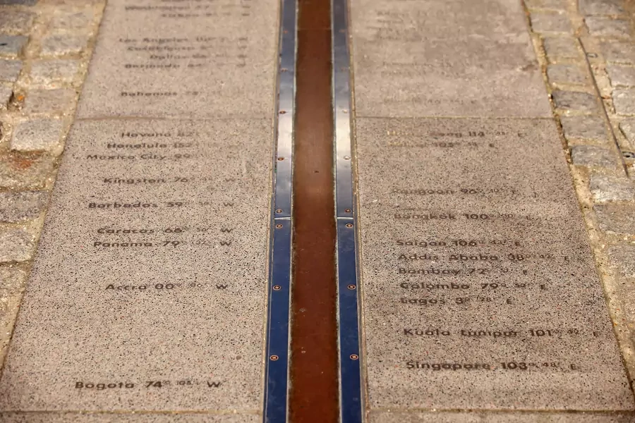 A line marks the 'Prime Meridian of the World' at Longitude 0 degrees at the Royal Observatory in Greenwich on March 26, 2012, in London. 