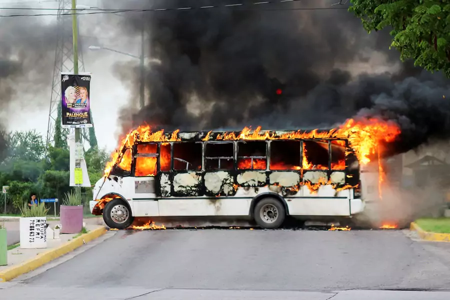 A burning bus, set alight by cartel gunmen to block a road, is pictured during clashes with federal forces following the detention of Ovidio Guzman, son of drug kingpin Joaquin "El Chapo" Guzman, in Culiacan, Sinaloa state, Mexico October 17, 2019.